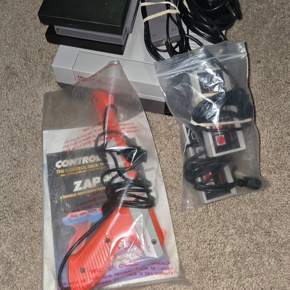 Nintendo NES bundle with 2 controllers, zapper, 4 games.